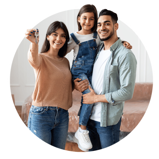 family holding keys to their new home
