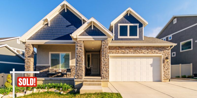 Newly sold home with a "SOLD" sign, representing a recent mortgage closing
